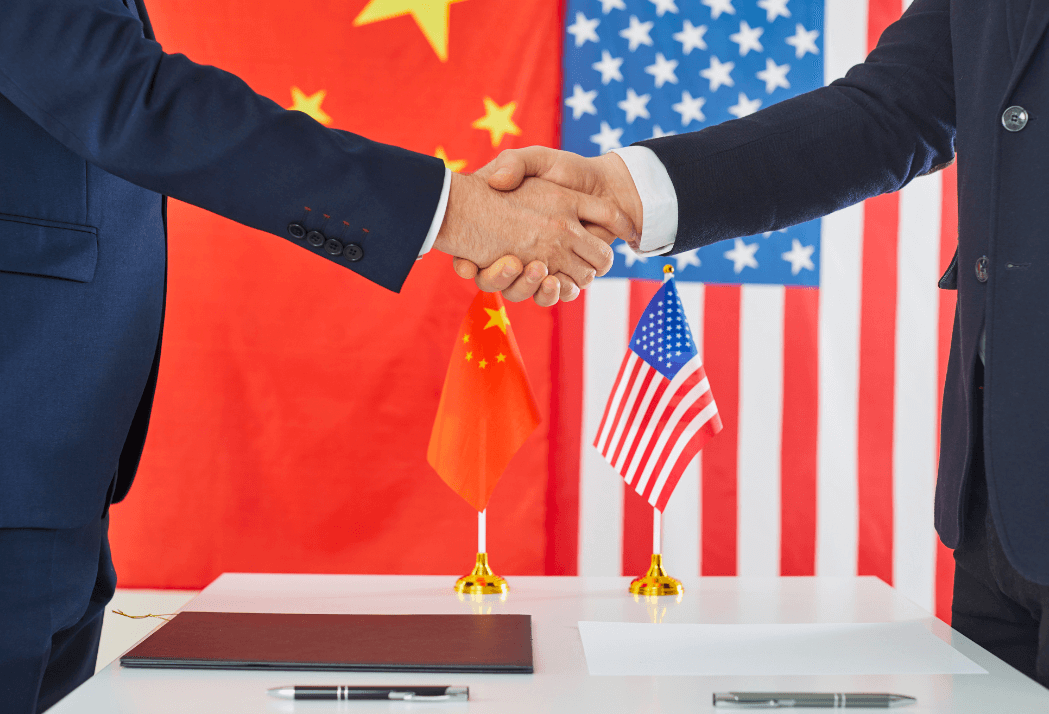 U.S.-China Trade Deal at APEC 2025 U.S. and Chinese officials shake hands after reaching a trade agreement at APEC 2025 in South Korea